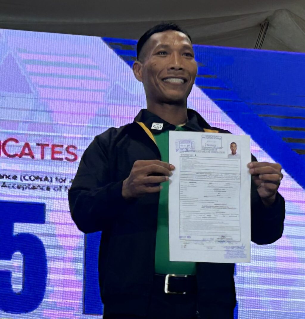 Deo Balbuena holds out the certificate of nomination and acceptance document he filed for a party-list representing vendors. 