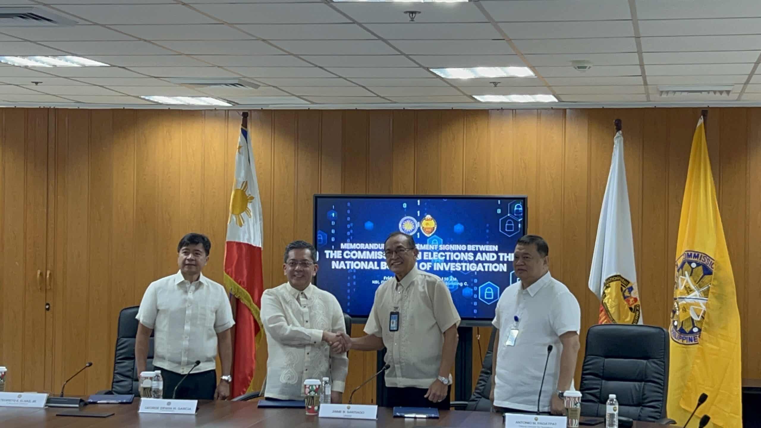 PHOTO: MOA signing between Comelec and NBI FOR STORY: NBI vows to crack down on vote-buying, poll-related cybercrimes